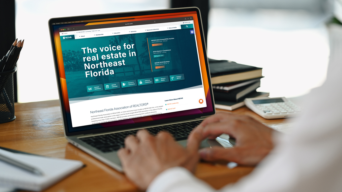 Person viewing the new NEFAR website on a laptop.