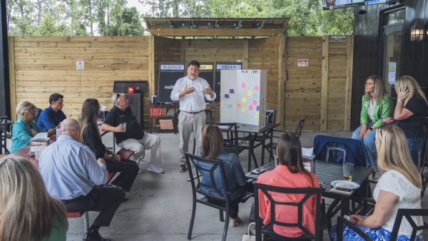 Jeremy Cox gives a presentation on the outside patio of V-Pizza in Flemming Island during YPN's Apps & Apps event.