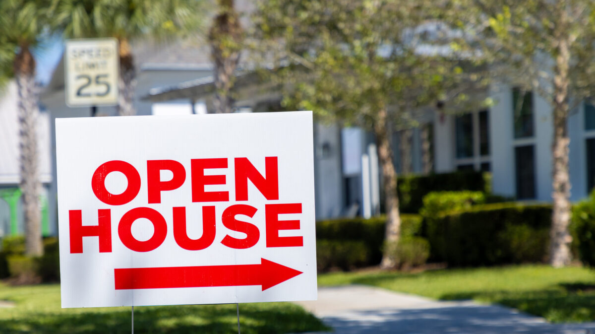 An open house sign in the suburbs.