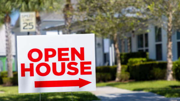An open house sign in the suburbs.