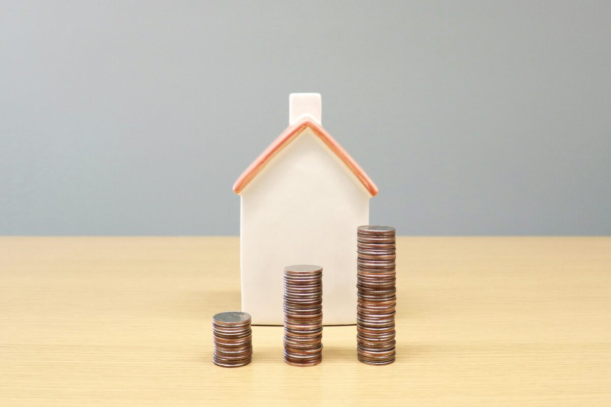 Home behind staakc of coins