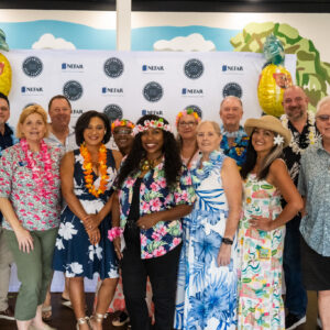 Members gathered together in tropical attire at the Southwest Area Council networking Mixer
